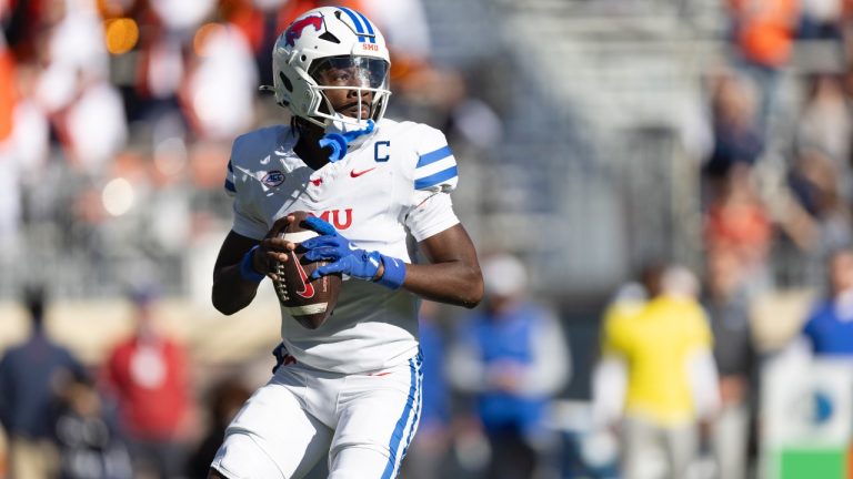 SMU quarterback Kevin Jennings looks to pass during the first half of an NCAA college football game against Virginia, Saturday, Nov. 23, 2024, in Charlottesville, Va. (Mike Kropf/AP)