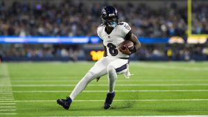 Baltimore Ravens quarterback Lamar Jackson runs with the ball for a touchdown during an NFL game against the Los Angeles Chargers, Monday, Nov. 25, 2024, in Inglewood, Calif. (AP/Kyusung Gong)