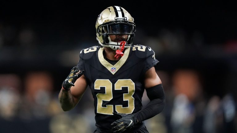 Marshon Lattimore (23) warms up before an NFL football game against the Carolina Panthers. (Gerald Herbert/AP)