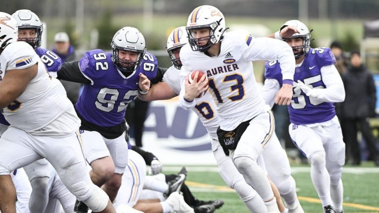 Laurier Golden Hawks quarterback Taylor Elgersma (13) runs for yards during first half Uteck Bowl football action against Bishop's Gaiters in Lennoxville, Que., Saturday November 16, 2024. (Graham Hughes/CP)
