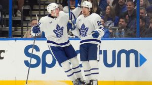 Toronto Maple Leafs left wing Nicholas Robertson (89) celebrates his goal against the Tampa Bay Lightning with centre Fraser Minten (39) during the second period of an NHL hockey game Saturday, Nov. 30, 2024, in Tampa, Fla. (Chris O'Meara/AP)