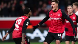 Leverkusen's scorer Patrik Schick, front right, and his teammate Arthur Augusto, left, celebrate their side's fourth goal during the German Bundesliga soccer match between Bayer 04 Leverkusen and 1. FC Heidenheim 1846 in Leverkusen, Germany, Saturday, Nov. 23, 2024. (Marius Becker/AP)