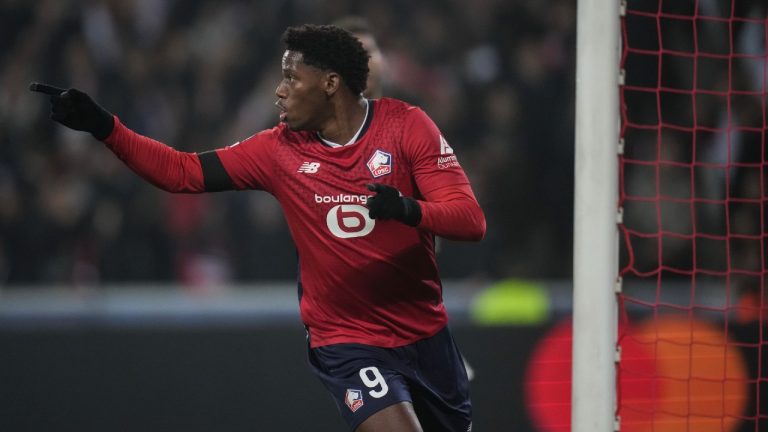 Lille's Jonathan David celebrates after scoring the opening goal during the Champions League opening phase soccer match between Lille and Juventus at the Stade Pierre Mauroy in Villeneuve-d'Ascq, outside Lille, France, Tuesday, Nov. 5, 2024. (Christophe Ena/AP)