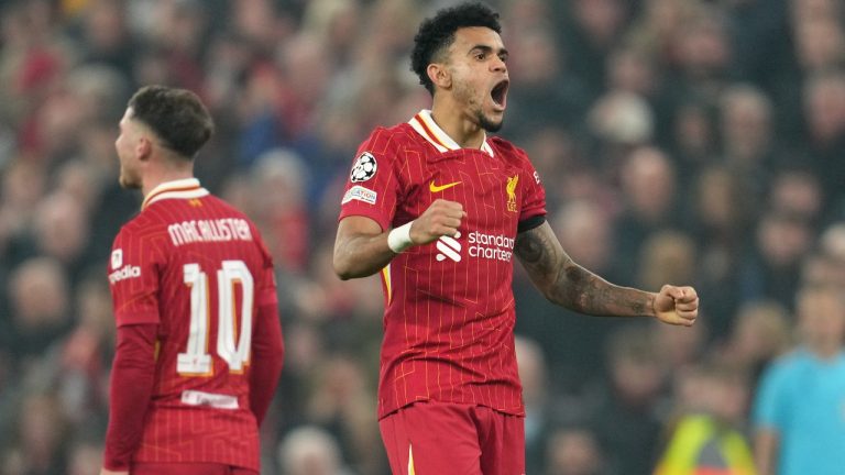 Liverpool's Luis Diaz celebrates after scoring his side's third goal during the Champions League opening phase soccer match between Liverpool and Bayer Leverkusen at Anfield in Liverpool, England, Tuesday, Nov. 5, 2024. (AP Photo/Jon Super)