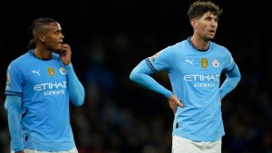 Manchester City's Manuel Akanji, left and John Stones react during the English Premier League soccer match between Manchester City and Tottenham at the Etihad Stadium in Manchester, England, Sunday, Nov. 24, 2024. (Dave Thompson/AP)