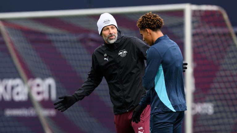 Leipzig coach Marco Rose, left, talks to Leipzig's Antonio Nusa during a training session, one day ahead of their Champions League soccer match against Inter Milan, in Leipzig, Germany, Monday Nov. 25, 2024. (Hendrik Schmidt/AP)