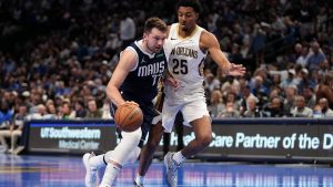 Dallas Mavericks guard Luka Doncic (77) drives to the basket as New Orleans Pelicans' Trey Murphy III (25) defends in the first half of an Emirates NBA Cup basketball game in Dallas, Tuesday, Nov. 19, 2024. (AP Photo/Tony Gutierrez)