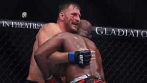 Stipe Miocic, left, reacts against Jon Jones in a UFC 309 mixed martial arts heavyweight title bout, early on Sunday, Nov. 17, 2024, in New York. (Adam Hunger/AP)