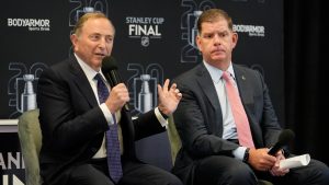 NHL Commissioner Gary Bettman, left, speaks before Game 1 of the NHL hockey Stanley Cup Finals between the Florida Panthers and the Edmonton Oilers Saturday, June 8, 2024, in Sunrise, Fla. At right is NHL Players Association Director Marty Walsh. (Lynne Sladky/AP)