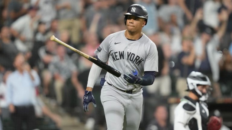 New York Yankees' Juan Soto tosses his bat after hitting a home run off Chicago White Sox relief pitcher Fraser Ellard, Soto's third of the game, during the seventh inning of a baseball game Tuesday, Aug. 13, 2024, in Chicago. (Charles Rex Arbogast/AP)