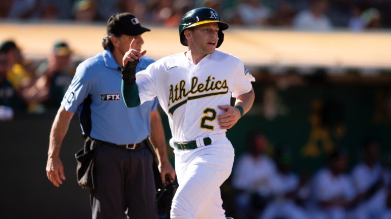 Oakland Athletics' Nick Allen scores on an RBI-single by Sean Murphy during the third inning against the San Francisco Giants, Saturday, Aug. 6, 2022, in Oakland, Calif. Umpire is Phil Cuzzi, back left, looks on. (AP)