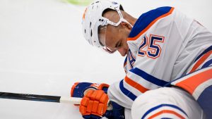 Edmonton Oilers defenceman Darnell Nurse (25) lays on the ice after colliding with Toronto Maple Leafs right wing Ryan Reaves (75) during second period NHL hockey action, in Toronto, Saturday, Nov. 16, 2024. (Christopher Katsarov/CP)