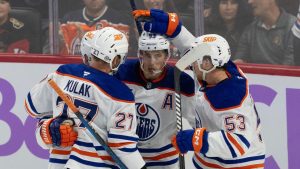 Edmonton Oilers centre Ryan Nugent-Hopkins is congratulated by teammates after scoring during third period NHL action against the Ottawa Senators, in Ottawa, Tuesday, Nov. 19, 2024. (Adrian Wyld/CP)