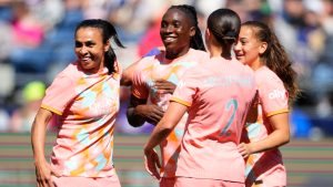 Orlando Pride forward Marta (10), forward Barbra Banda (22), midfielder Haley McCutcheon (2) and forward Summer Yates, right, celebrate during an NWSL soccer match against the Seattle Reign, Sunday, May 19, 2024, in Seattle. Orlando won 3-2. (Lindsey Wasson/AP)