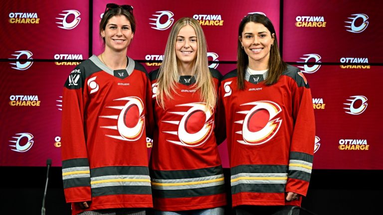 Ottawa Charge's Zoe Boyd, left to right, Rebecca Leslie and Jincy Roese wear their new team jerseys for a photo during a news conference showcasing the new jerseys for the 2024-25 Professional Women’s Hockey League season, in Ottawa, on Thursday, Nov. 7, 2024. THE CANADIAN PRESS/Justin Tang