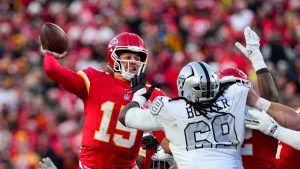 Kansas City Chiefs quarterback Patrick Mahomes (15) throws over Las Vegas Raiders defensive tackle Adam Butler (69) during the second half of an NFL football game. (Ed Zurga/AP)