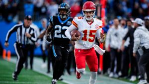 Chiefs quarterback Patrick Mahomes (15) runs in overtime against the Carolina Panthers, Sunday, Nov. 24, 2024, in Charlotte, N.C. (Jacob Kupferman/AP)