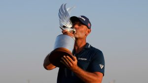 Paul Waring of England kisses the trophy during the awards ceremony after winning the Abu Dhabi Golf Championship in Abu Dhabi, United Arab Emirates, Sunday, Nov. 10, 2024. (AP/Altaf Qadri)