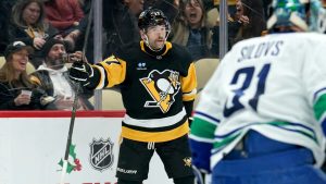 Pittsburgh Penguins' Bryan Rust (17) celebrates after scoring against Vancouver Canucks goaltender Arturs Silovs (31) during the second period of an NHL hockey game Wednesday, Nov. 27, 2024, in Pittsburgh. (Matt Freed/AP)