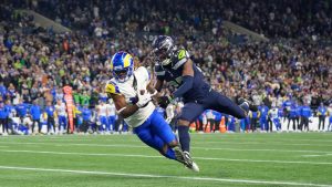 Los Angeles Rams wide receiver Demarcus Robinson, left, catches a touchdown pass against Seattle Seahawks cornerback Riq Woolen during overtime of an NFL football game. (Lindsey Wasson/AP)