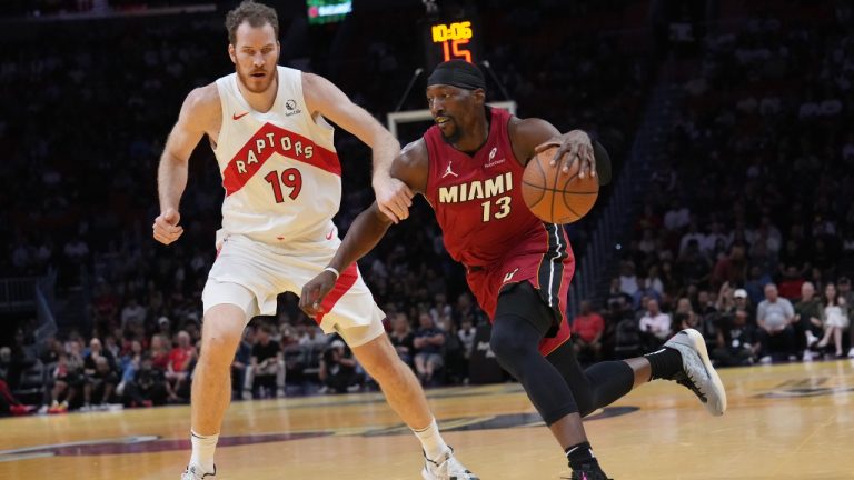 Miami Heat centre Bam Adebayo (13) drives to the basket as Toronto Raptors centre Jakob Poeltl (19) defends during the first half of an Emirates NBA Cup basketball game, Friday, Nov. 29, 2024, in Miami. (Lynne Sladky/AP)