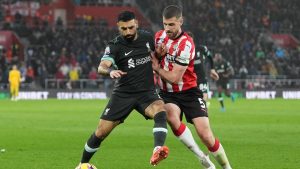 Liverpool's Mohamed Salah, left, and Southampton's Jack Stephens fight for the ball during the English Premier League soccer match between Southampton and Liverpool in Southampton, England, Sunday, Nov. 24, 2024. (Sean Ryan/AP)