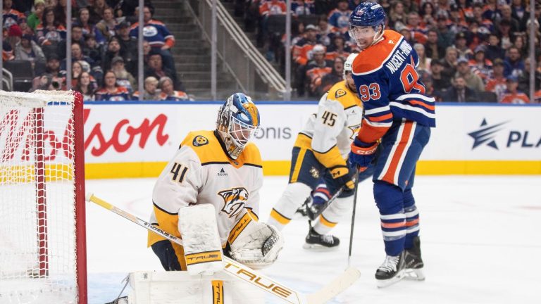 Nashville Predators goalie Scott Wedgewood makes the save as Edmonton Oilers' Ryan Nugent-Hopkins looks on during second period NHL action in Edmonton on Thursday, November 14, 2024. )THE CANADIAN PRESS/Jason Franson)