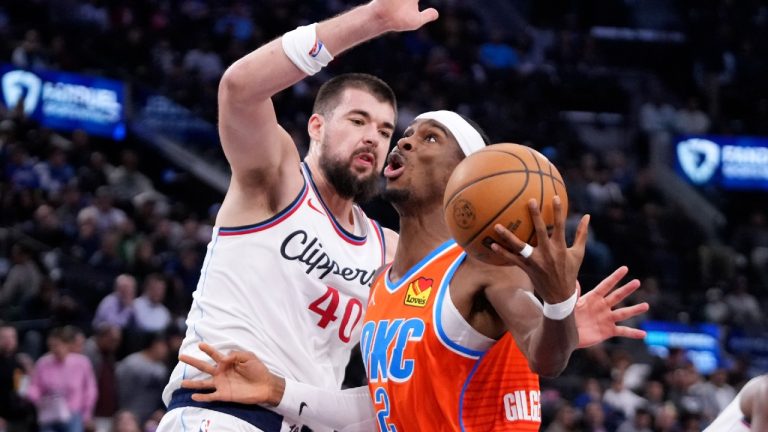 Oklahoma City Thunder guard Shai Gilgeous-Alexander, right, shoots as Los Angeles Clippers center Ivica Zubac defends during the first half of an NBA basketball game, Saturday, Nov. 2, 2024, in Inglewood, Calif. (Mark J. Terrill/AP)