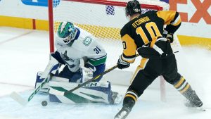 Vancouver Canucks goaltender Arturs Silovs (31) makes a save against Pittsburgh Penguins' Drew O'Connor (10) during the first period of an NHL hockey game Wednesday, Nov. 27, 2024, in Pittsburgh. (Matt Freed/AP)