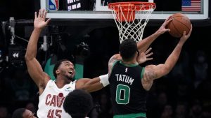 Boston Celtics forward Jayson Tatum (0) drives to the basket against Cleveland Cavaliers guard Donovan Mitchell (45) during the first half of an Emirates NBA Cup basketball game, Tuesday, Nov. 19, 2024, in Boston. (Charles Krupa/AP)