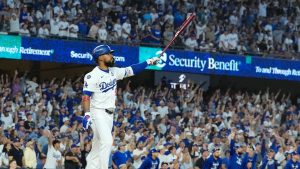 Los Angeles Dodgers' Teoscar Hernández watches his two-run home run against the New York Yankees during the third inning in Game 2 of the World Series, Saturday, Oct. 26, 2024, in Los Angeles. (AP/Godofredo A. Vasquez)