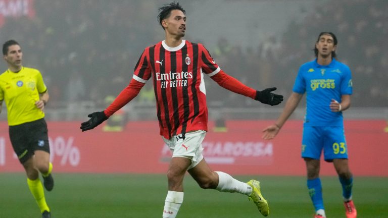 AC Milan's Tijjani Reijnders celebrates scoring his side's third goal during the Italian Serie A soccer match between AC Milan and Empoli. (Luca Bruno/AP)