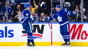 Toronto Maple Leafs' Conor Timmins (right) celebrates his goal with Steven Lorentz (18) during first period NHL action against the Montreal Canadiens, in Toronto on Saturday, November 9, 2024. (Christopher Katsarov/CP)