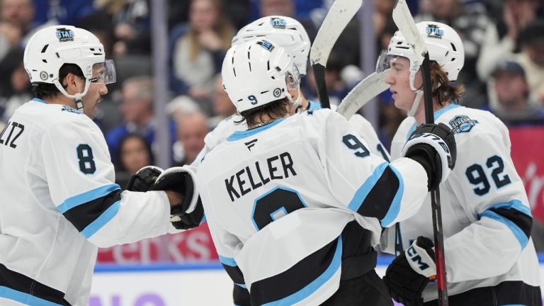 Utah Hockey Club centre Logan Cooley (92) celebrates his goal against the Toronto Maple Leafs with teammates during first period NHL hockey action in Toronto on Sunday, November 24, 2024. (Frank Gunn/CP)