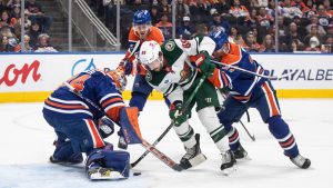 Minnesota Wild's Frederick Gaudreau (89) is stopped by Edmonton Oilers goalie Stuart Skinner (74) as Brett Kulak (27) and Mattias Janmark (13) defend during first period NHL action in Edmonton on Thursday, November 21, 2024. THE CANADIAN PRESS/Jason Franson