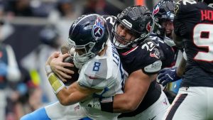 Houston Texans defensive tackle Tommy Togiai (72) sacks Tennessee Titans quarterback Will Levis (8) during the second half an NFL football game Sunday, Nov. 24, 2024, in Houston. (Ashley Landis/AP)