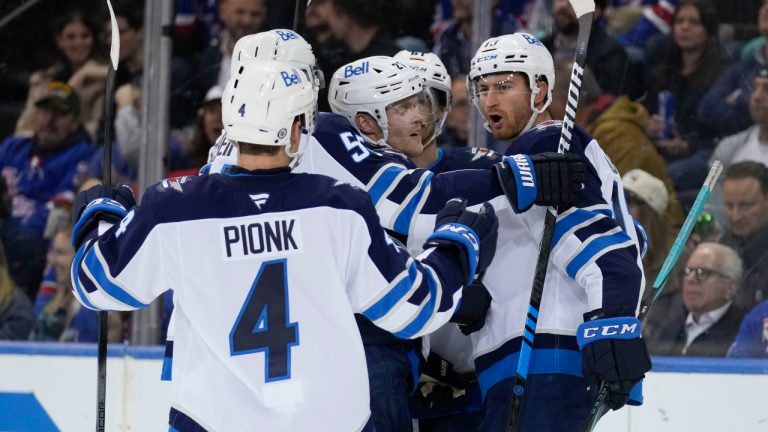 Winnipeg Jets' Gabriel Vilardi, right, celebrates his goal with teammates during the second period of an NHL hockey game against the New York Rangers Tuesday, Nov. 12, 2024, in New York. (AP Photo/Seth Wenig)