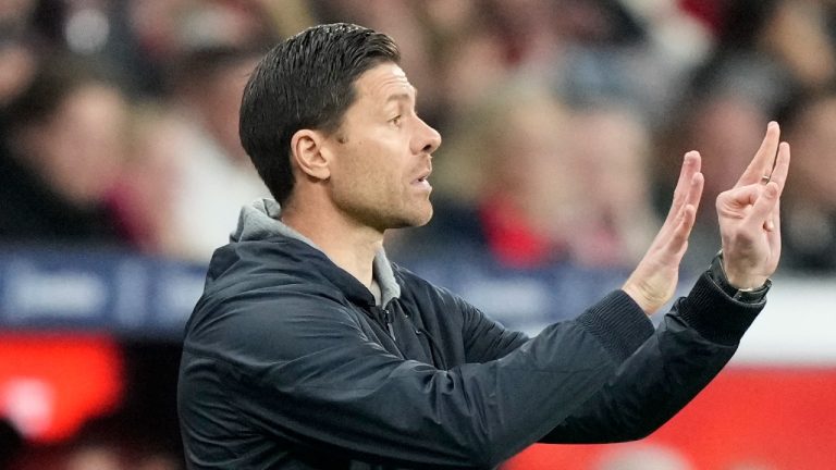 Leverkusen head coach Xabi Alonso gives instructions from the side line during the German Bundesliga soccer match between Bayer Leverkusen and VfB Stuttgart at the BayArena in Leverkusen, Germany, Friday, Nov. 1, 2024. (AP/Martin Meissner)