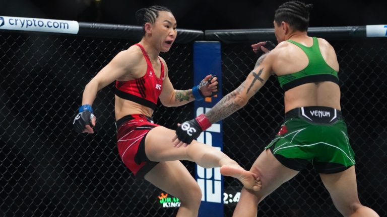 Yan Xiaonan kicks Jessica Andrade during a strawweight bout at UFC 288. (Frank Franklin II/AP)