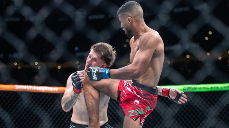 Jack Shore, left, takes a knee to the face from Youssef Zalal during a featherweight bout at UFC Fight Night in Edmonton on Saturday, November 2, 2024. (Jason Franson/CP)