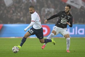 Lille's Edon Zhegrova challenges for the ball during the French League One soccer match between Lille and Rennes  Sunday, Nov. 24, 2024. (Matthieu Mirville/AP)