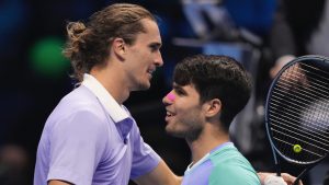 Germany's Alexander Zverev, left, smiles with Spain's Carlos Alcaraz at the end of the singles tennis match of the ATP World Tour Finals at the Inalpi Arena, in Turin, Italy, Friday, Nov. 15, 2024. (Antonio Calanni/AP)