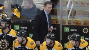 Boston Bruins interim head coach Joe Sacco, centre top, shouts to his players in the second period of an NHL hockey game against the Utah Hockey Club, Thursday, Nov. 21, 2024, in Boston. (Steven Senne/AP)