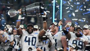 Toronto Argonauts' Robbie Smith (40) hoists the Grey Cup with teammates after defeating the Winnipeg Blue Bombers in the 111th Grey Cup. (Frank Gunn/CP)