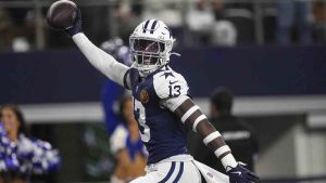 Dallas Cowboys linebacker DeMarvion Overshown (13) celebrates as he runs in for a touchdown on an interception against the New York Giants during the first half of an NFL football game in Arlington, Texas, Thursday, Nov. 28, 2024. (AP Photo/Jerome Miron)