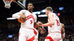 Toronto Raptors guard RJ Barrett (9) helps centre Jakob Poeltl (19) off the floor during second half NBA basketball action against the Indiana Pacers, in Toronto, Monday, Nov. 18, 2024. (Christopher Katsarov/CP)