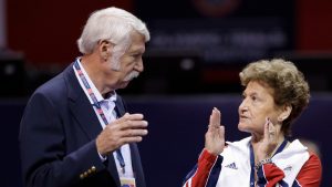 Bela Karolyi, left, and his wife, Martha Karolyi, right, talk on the arena floor before the start of the preliminary round of the women's Olympic gymnastics trials in San Jose, Calif., June 29, 2012. (Gregory Bull/AP)