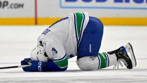 Vancouver Canucks right wing Brock Boeser on the ice after taking an illegal check to the head from Los Angeles Kings forward Tanner Jeannot (not pictured) during an NHL hockey game, Thursday, Nov. 7, 2024, in Los Angeles. (Jayne-Kamin-Oncea/AP)