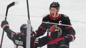 Ottawa Senators left wing Brady Tkachuk (7) celebrates his goal with teammate Tim Stützle (18) during third period NHL action against the Calgary Flames on Monday, Nov. 25, 2024 in Ottawa. (Adrian Wyld/CP)