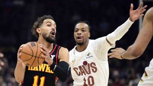 Atlanta Hawks guard Trae Young drives on Cleveland Cavaliers guard Darius Garland in the first half of an NBA basketball game, Wednesday, Nov. 27, 2024, in Cleveland. (David Dermer/AP)